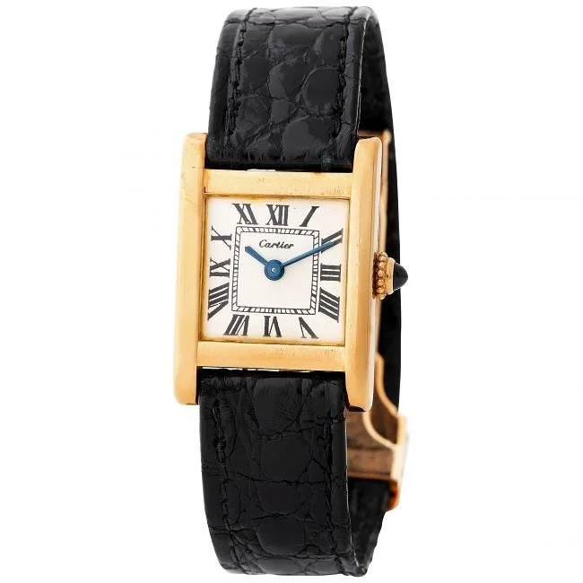 Gold Cartier Tank watch with white dial, black Roman numerals, and black leather strap.