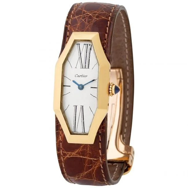 Vintage gold Cartier watch with elongated octagonal case, white dial, and brown alligator strap.