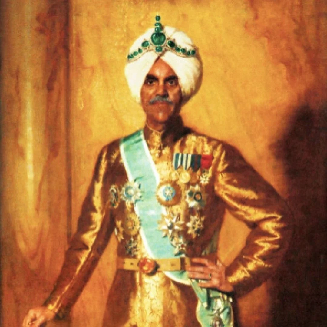Portrait of a man in a gold brocade uniform, emerald turban, and many medals.