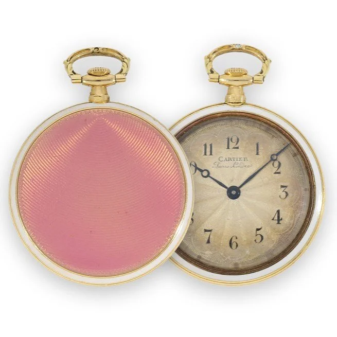 Two gold and white enamel Cartier pocket watches: one pink guilloché, the other open.
