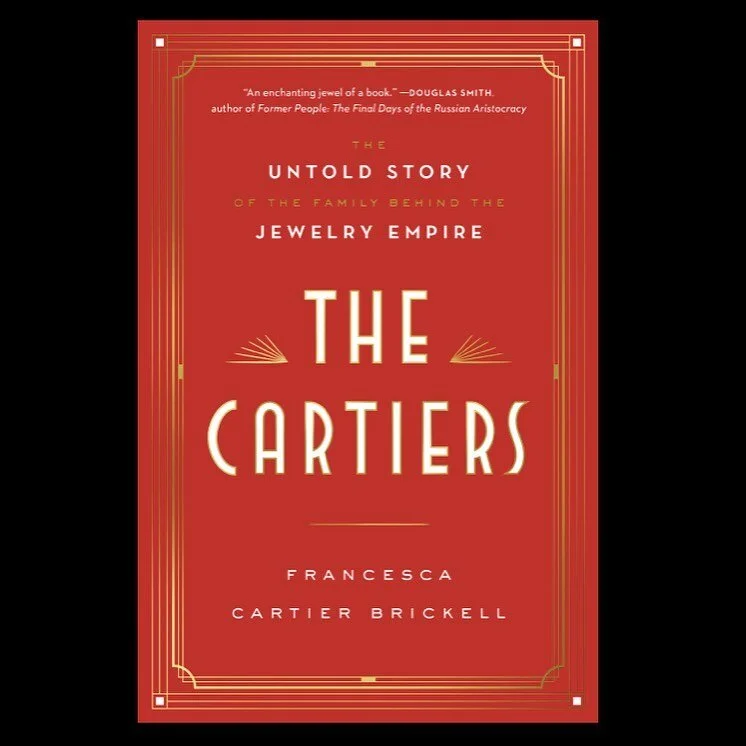 Red book cover, gold Art Deco border, 'The Cartiers' by Francesca Cartier Brickell.