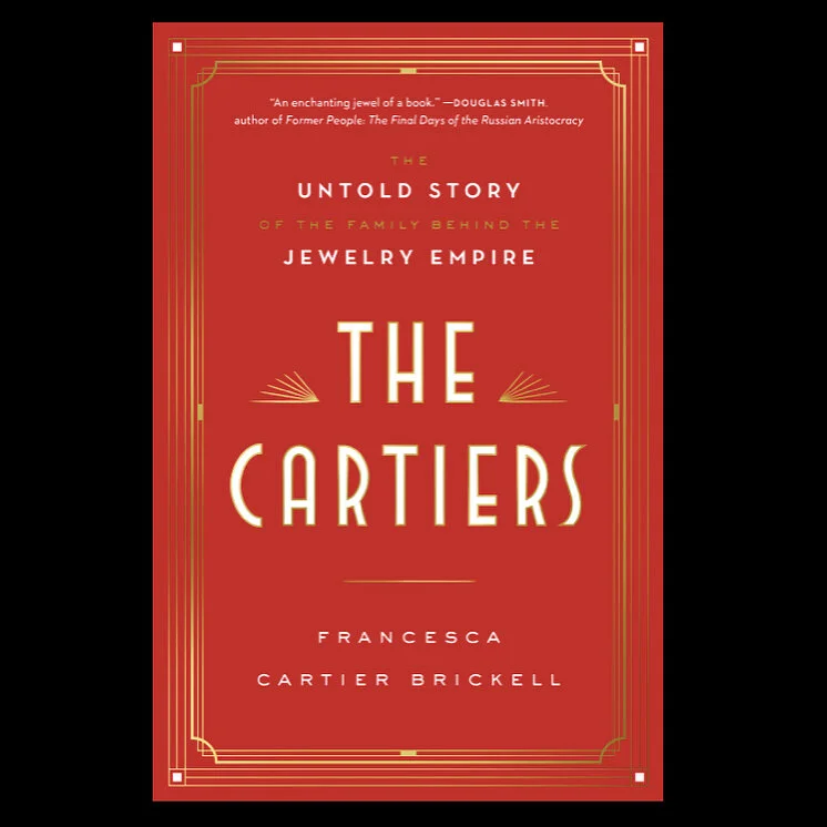 Red book cover with gold Art Deco border and "THE CARTIERS" title.